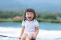 Adorable little girl laughing and happiness playing on swimming pool.Cute Asian kid smile and relax with activity outdoors.Kid Royalty Free Stock Photo