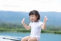 Adorable little girl laughing and happiness playing on swimming pool.Cute Asian kid smile and relax with activity outdoors.Kid Royalty Free Stock Photo