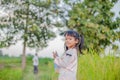 Adorable little girl laughing in a meadow - happy girl at sunset Royalty Free Stock Photo