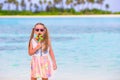 Adorable little girl with lollipop on tropical Royalty Free Stock Photo