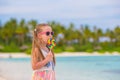 Adorable little girl with lollipop on tropical Royalty Free Stock Photo