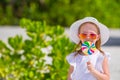 Adorable little girl with lollipop on tropical Royalty Free Stock Photo