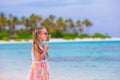 Adorable little girl with lollipop on tropical Royalty Free Stock Photo