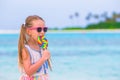 Adorable little girl with lollipop on tropical Royalty Free Stock Photo