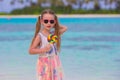 Adorable little girl with lollipop on tropical Royalty Free Stock Photo