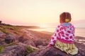 Adorable little girl looking at the sunset Royalty Free Stock Photo