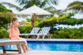 Adorable little girl making selfie near a swimming pool Royalty Free Stock Photo