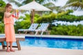 Adorable little girl making selfie near a swimming pool Royalty Free Stock Photo