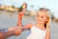 Adorable Little Girl Picking out Lollipop Outside Royalty Free Stock Photo