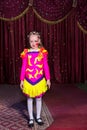 Adorable little girl in a pink and yellow costume Royalty Free Stock Photo