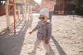 Adorable little girl play with her mom in the playground. Mom and daughter spend time together in Mother`s Day. Happy Royalty Free Stock Photo