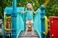 Adorable little girl on playground on a sunny day Royalty Free Stock Photo