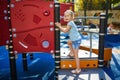 Adorable little girl on playground on a sunny day Royalty Free Stock Photo