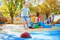 Adorable little girl on playground on a sunny day Royalty Free Stock Photo