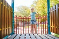 Adorable little girl on playground on a sunny day Royalty Free Stock Photo