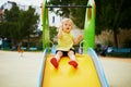 Adorable little girl on playground on a sunny day Royalty Free Stock Photo