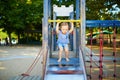 Adorable little girl on playground on a sunny day Royalty Free Stock Photo