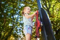 Adorable little girl on playground on a sunny day Royalty Free Stock Photo