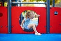 Adorable little girl on playground on a sunny day Royalty Free Stock Photo