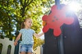 Adorable little girl on playground on a sunny day Royalty Free Stock Photo