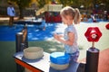 Adorable little girl on playground on a sunny day Royalty Free Stock Photo