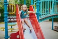 Adorable little girl on playground on a sunny day Royalty Free Stock Photo