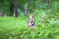 Adorable little girl playing in an autumn park Royalty Free Stock Photo