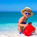 Adorable little girl playing with beach toys