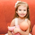 Adorable little girl playing with a doll Royalty Free Stock Photo