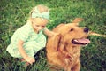 Adorable little girl playing with her pet dog Royalty Free Stock Photo