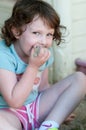 Adorable little girl playing in a sandbox Royalty Free Stock Photo