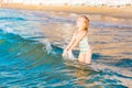 Adorable little girl playing in the sea on a beach Royalty Free Stock Photo