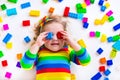 Adorable little girl playing with toy blocks Royalty Free Stock Photo