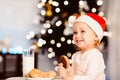 Adorable little girl preparing milk and cookies on Christmas Eve Royalty Free Stock Photo