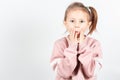 Adorable little girl puts myofunctional trainer in the mouth. Royalty Free Stock Photo