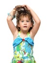 Adorable little girl raises her hair Royalty Free Stock Photo