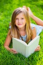 Adorable little girl reading book Royalty Free Stock Photo