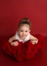 Adorable little girl in red pettiskirt tutu