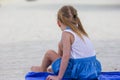 Adorable little girl sitting on chair at tropical Royalty Free Stock Photo