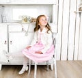 Adorable little girl sitting on chair Royalty Free Stock Photo