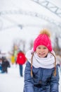 Adorable little girl skating on the ice-rink Royalty Free Stock Photo