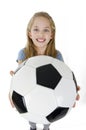 Adorable little girl with the soccer ball. Isolated on white background. Royalty Free Stock Photo