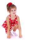 Adorable little girl squatted