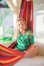 Adorable little girl on tropical vacation relaxing in hammock Royalty Free Stock Photo