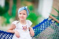 Adorable little girl on tropical vacation relaxing in hammock Royalty Free Stock Photo