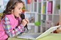 Adorable little girl using modern laptop Royalty Free Stock Photo