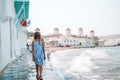 Adorable little girl at Little Venice the most popular tourist area on Mykonos island, Greece. Royalty Free Stock Photo