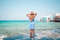 Adorable little girl at Little Venice the most popular tourist area on Mykonos island, Greece. Royalty Free Stock Photo