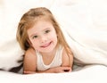 Adorable little girl waked up in bed