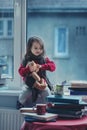 Adorable little girl, writing letter to Santa, sitting on a wind Royalty Free Stock Photo